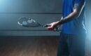 Male squash player training on indoor court