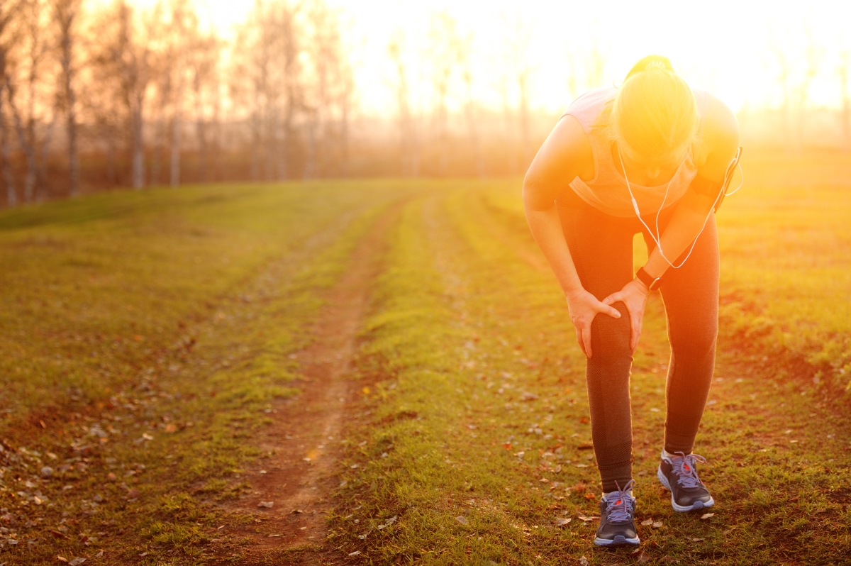 sports running knee injury on woman