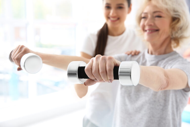 in-home-physical-therapist-helping-their-patient-use-free-weights