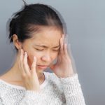 Woman with vertigo, dizziness