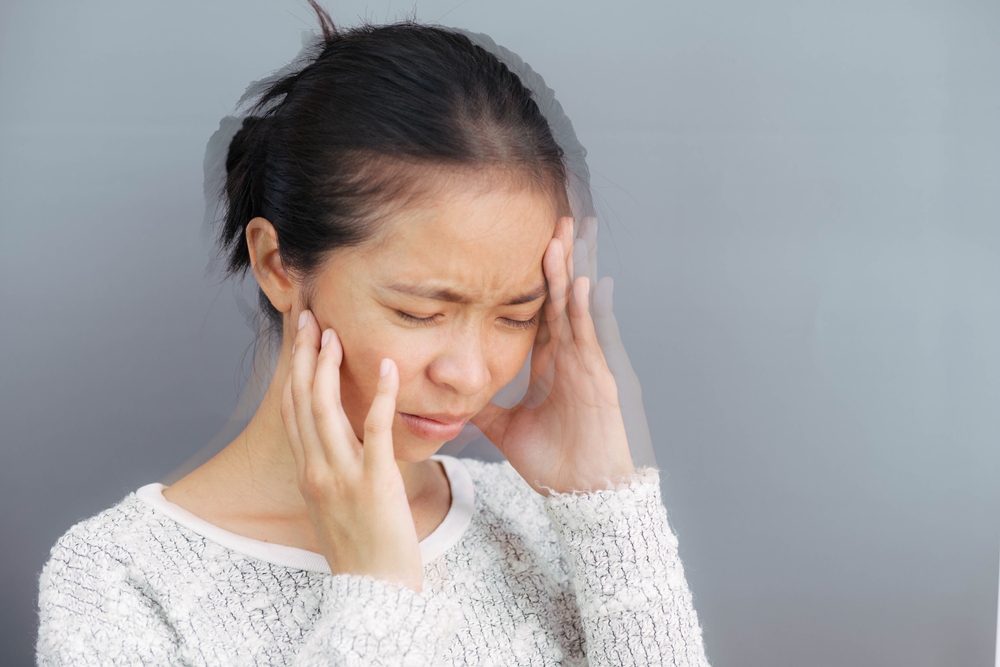 Woman with vertigo, dizziness