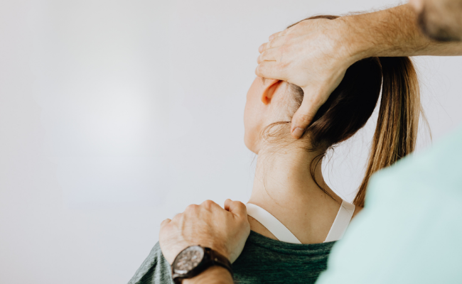 Neurological physiotherapy session in Edmonton focusing on guided neck support