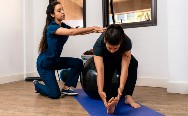 Balance and forward-reach exercise supported during neurological physiotherapy in Surrey