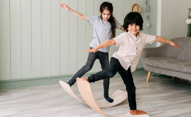 Children practice balance and coordination through play during pediatric physiotherapy in Edmonton