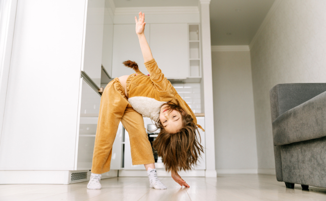 Child practicing balance and movement during pediatric physiotherapy in Calgary