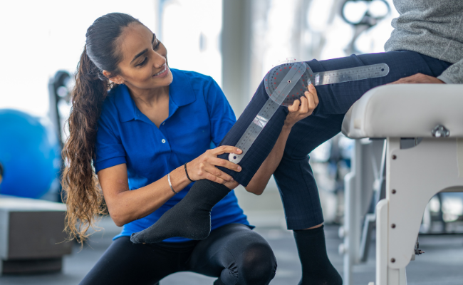 Knee range-of-motion being measured during post-surgery physiotherapy in Surrey